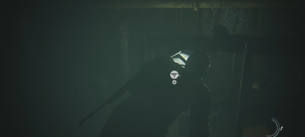Silhouetted person holding flashlight in dark room