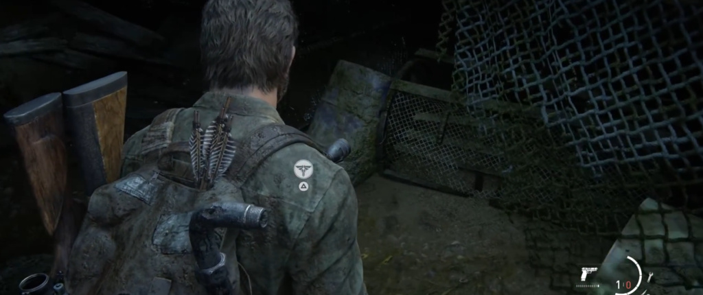 Joel explores dark tunnel in The Last of Us