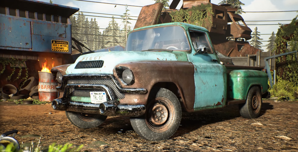 Rusty blue pickup truck parked in scrapyard