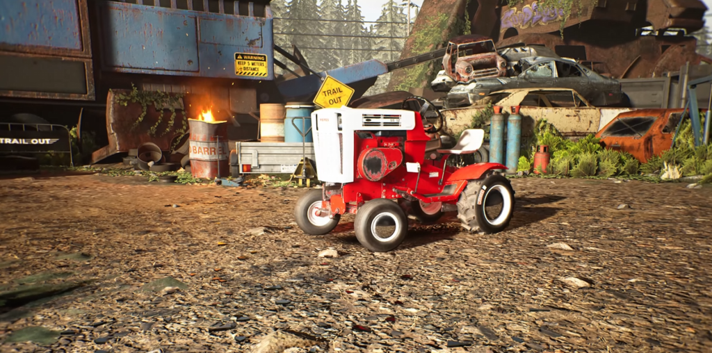 Red lawn tractor parked in junkyard lot