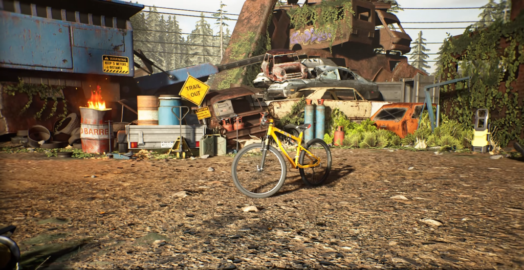 Yellow bicycle standing in scrapyard with stacked cars