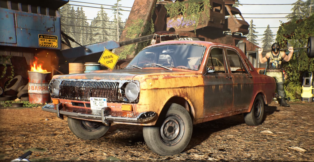 Rusty orange car parked in scrapyard yard