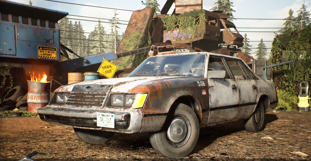 Rusty station wagon parked in junkyard trail entrance