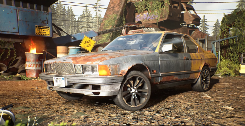 Rusty sedan parked in junkyard with warning signs