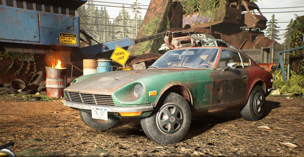 Green and red car parked in scrapyard