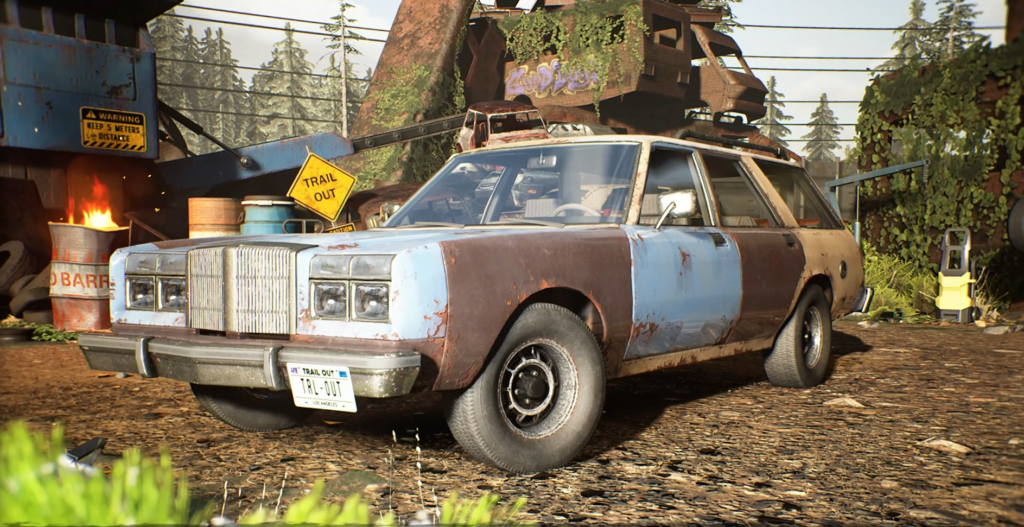 Rusty blue station wagon parked in scrapyard