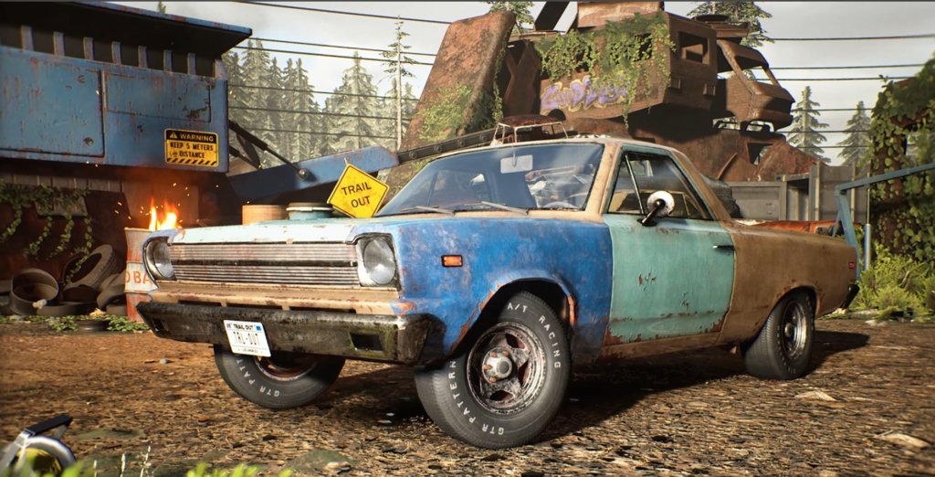 Rusty blue pickup truck parked in scrapyard