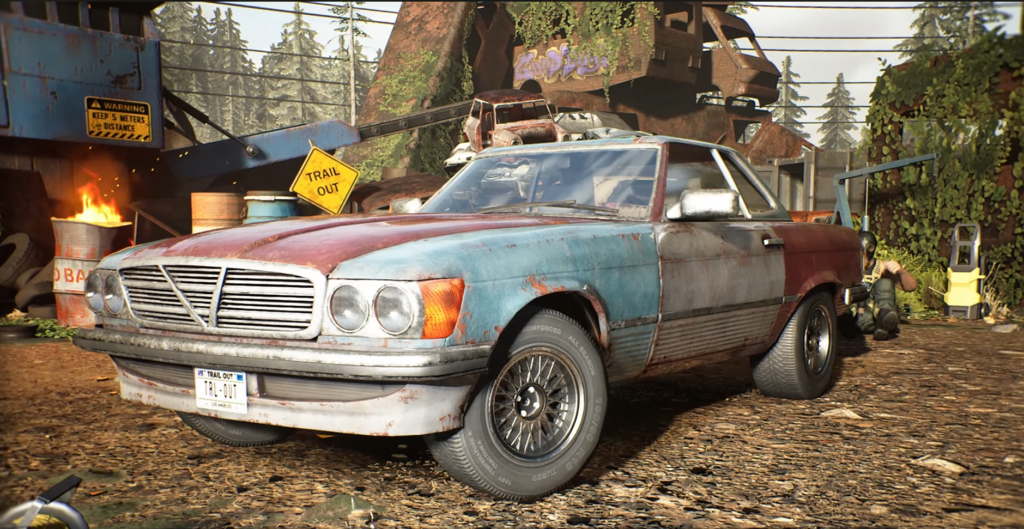 Rusty blue and red car parked in scrapyard