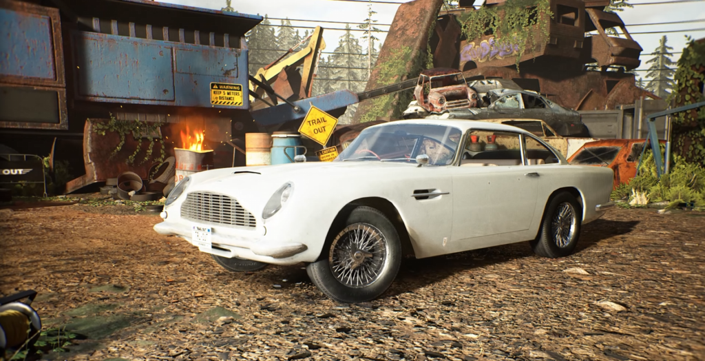 White sports car parked in scrapyard with fire barrel
