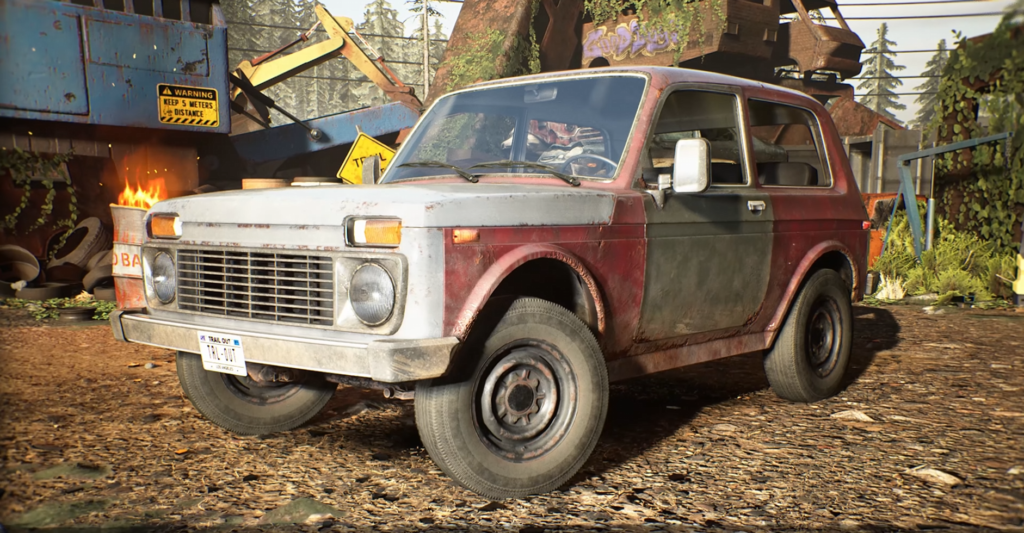Red and white SUV parked in scrapyard