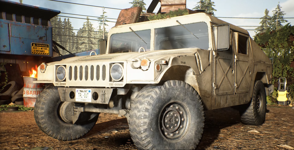 Tan military Humvee parked in forest camp