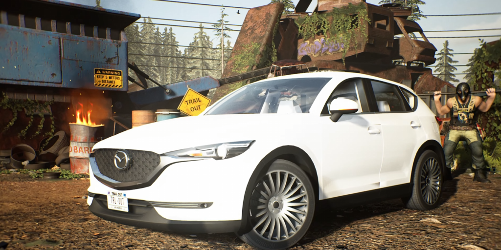 White Mazda SUV parked in scrapyard setting