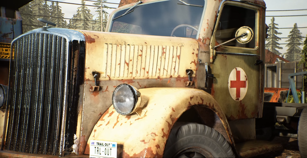 Rusty beige ambulance truck parked outdoors near trees