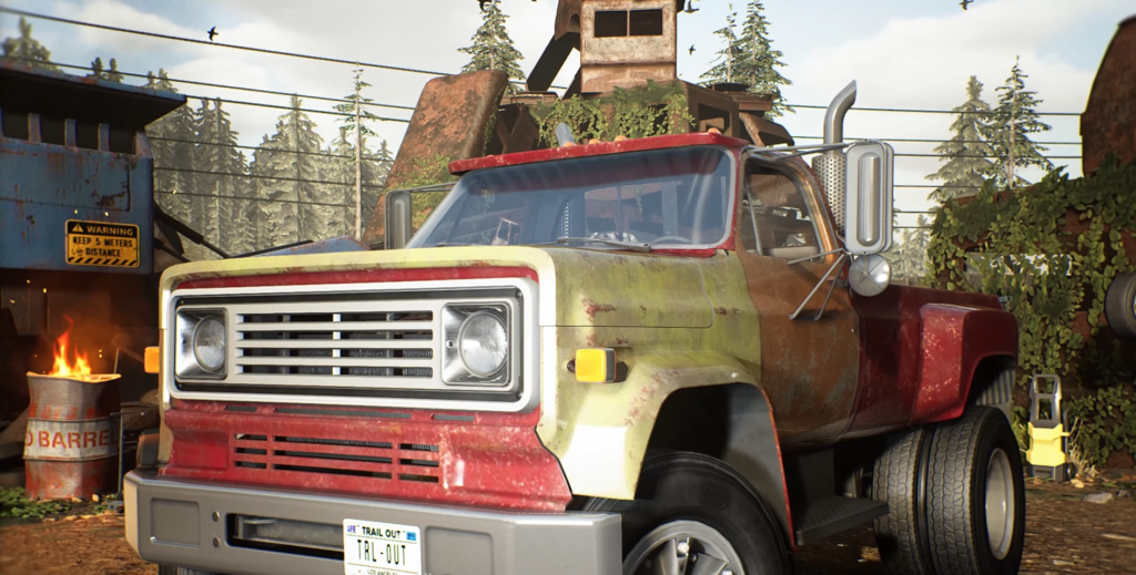 Rusty red truck parked in scrapyard setting