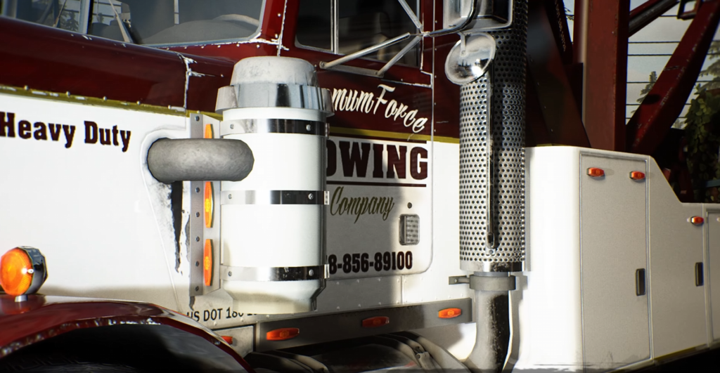 Maroon tow truck cab parked outdoors