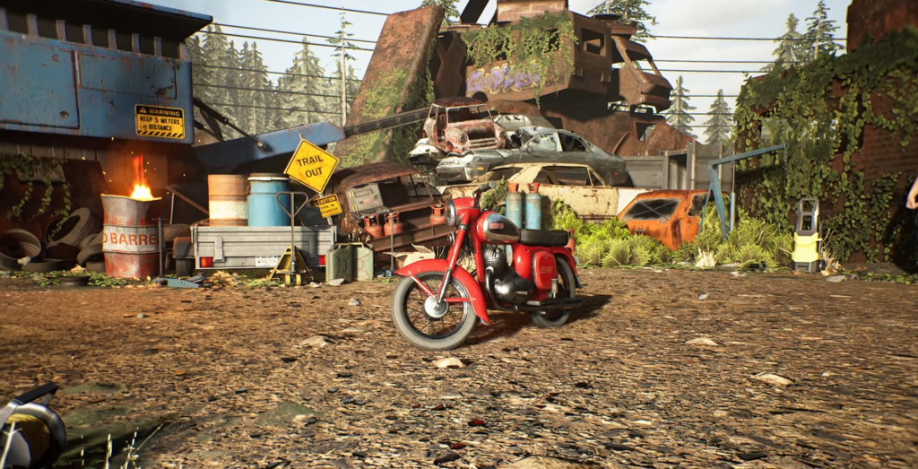 Red motorcycle parked in junkyard with stacked cars