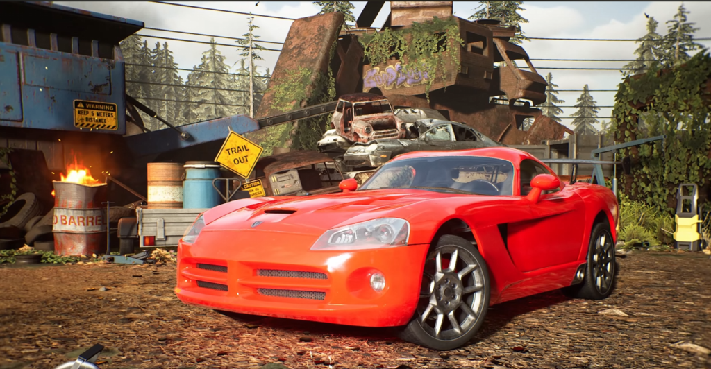 Red sports car parked in scrapyard with wrecks