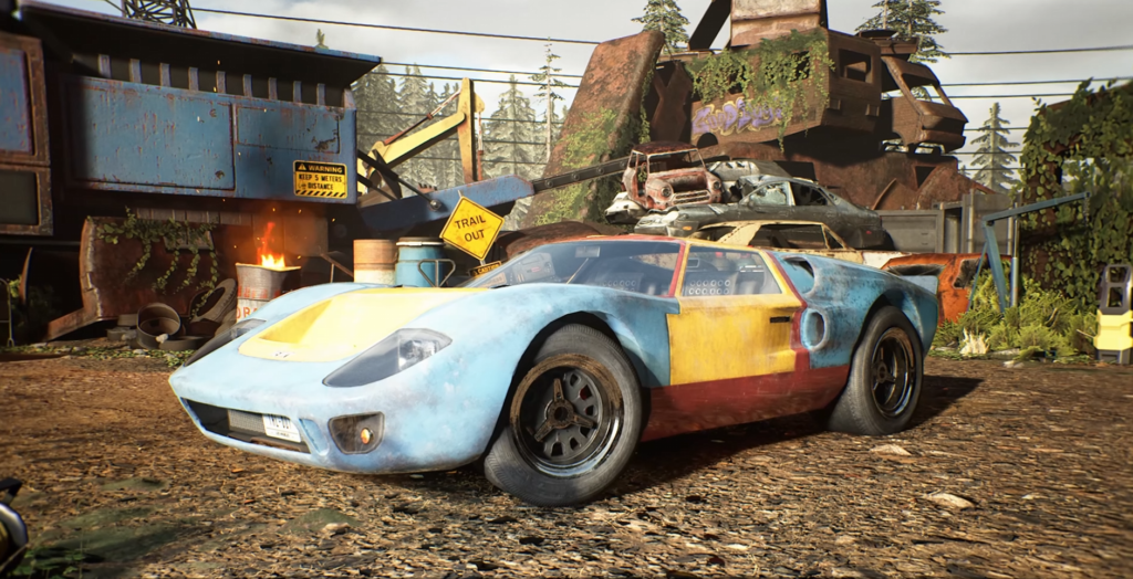 Blue and yellow race car parked in scrapyard