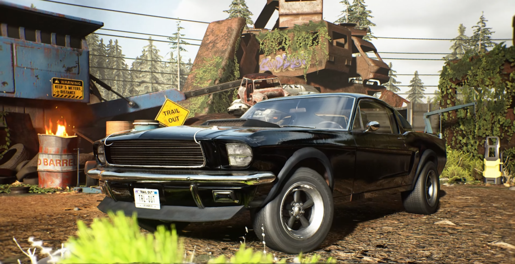 Black muscle car parked in scrapyard trail setting