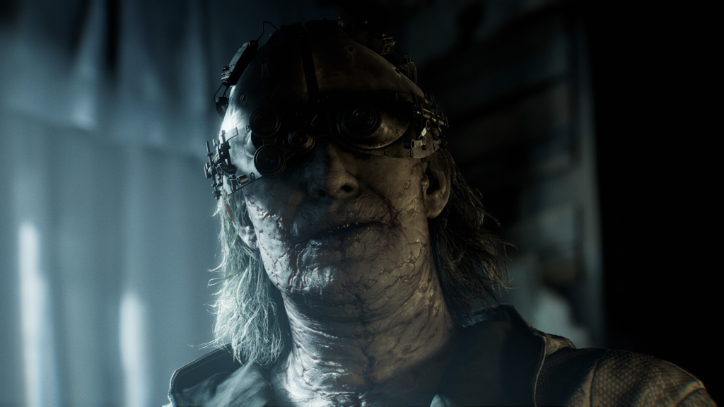 Scarred person wearing black goggles indoors