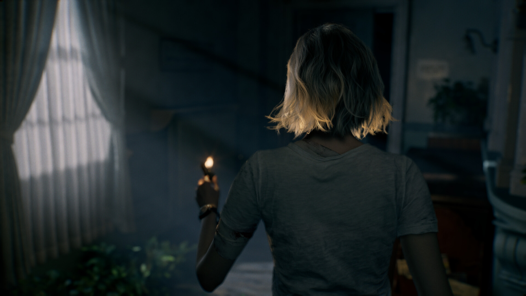 Blonde woman holding lighter in dark room