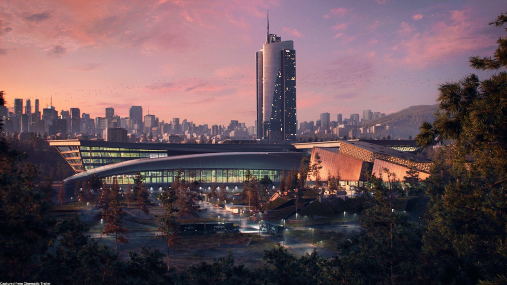Modern stadium complex at sunset with city skyline