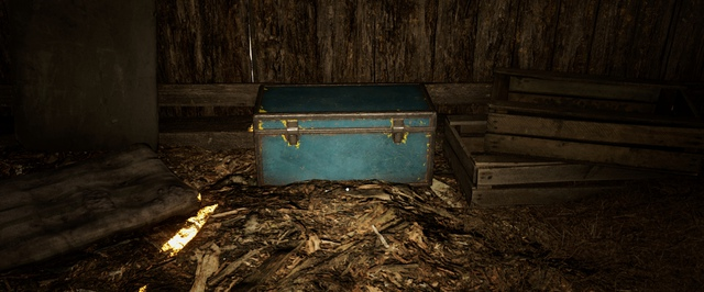 Blue storage chest sitting on wooden floor indoors