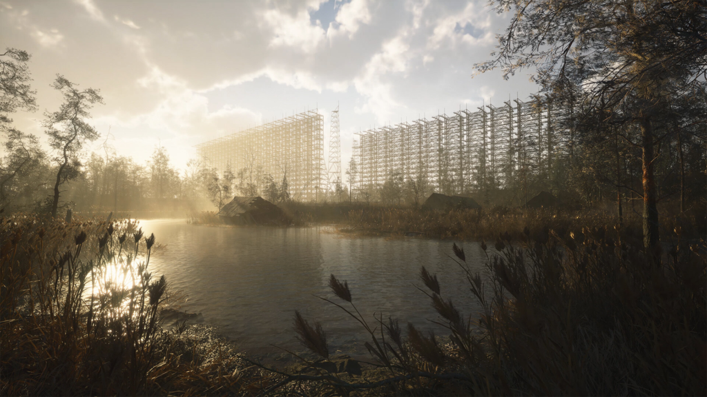 Sunlight reflects on lake beside metal scaffolding structures
