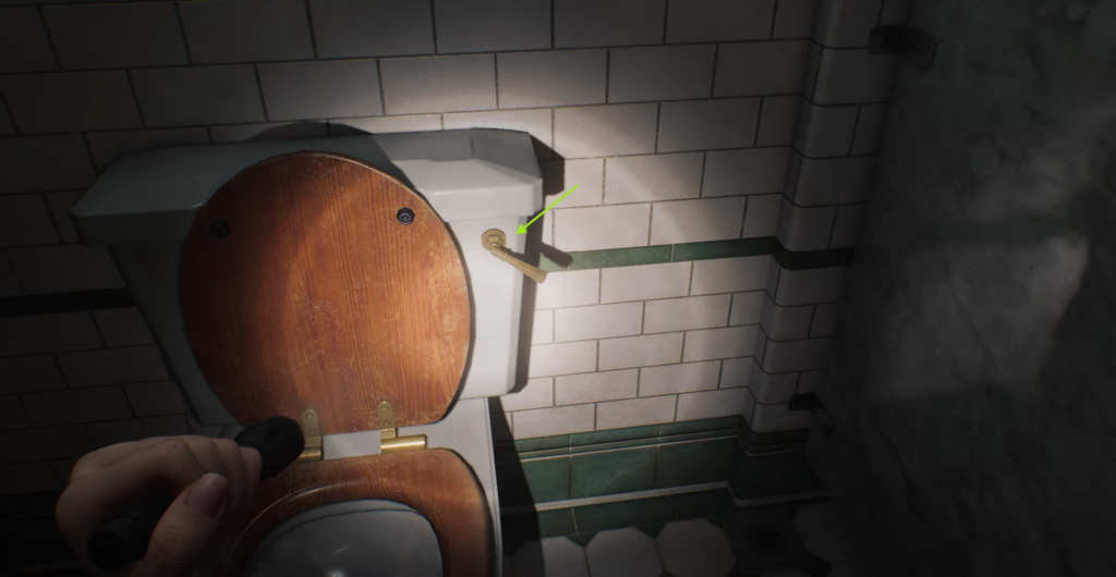 Hand holding flashlight beside toilet tank lever