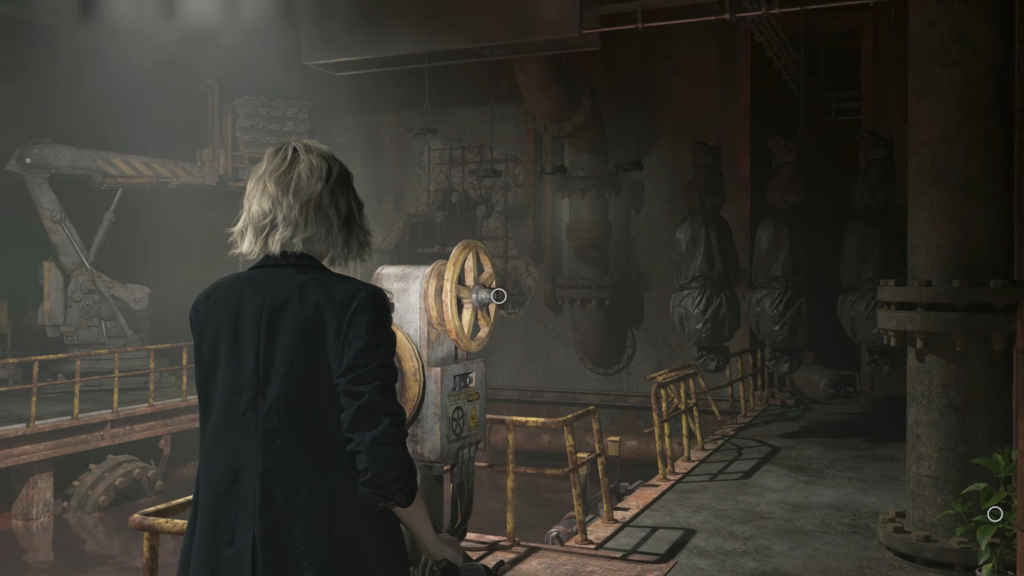 Person turns valve in industrial room