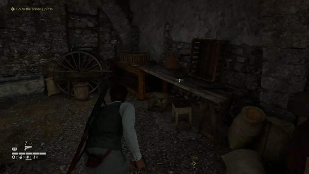 Player crouches in stone cellar beside wooden table