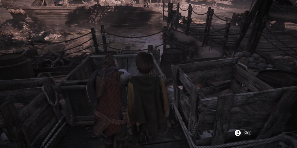 Amicia and Hugo hide in cart in A Plague Tale: Innocence.