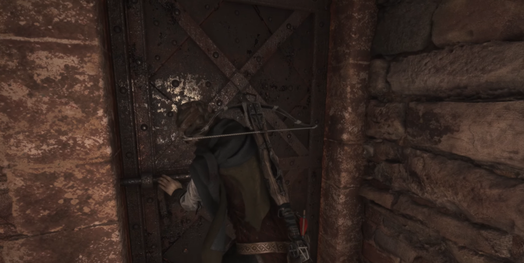 Amicia A Plague Tale opening wooden door.