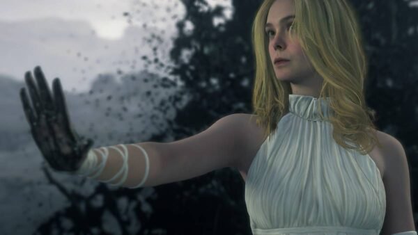 Blonde woman raises hand in dark smoky scene