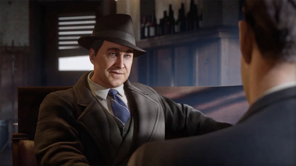 Man in fedora talking in bar booth