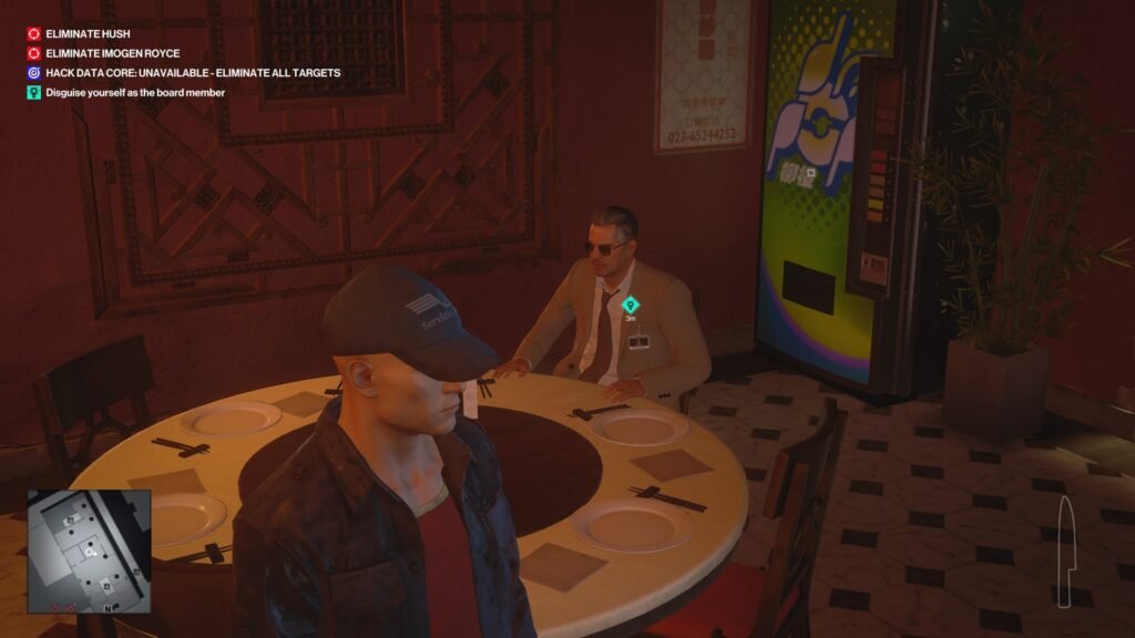 Hitman 3 Agent 47 watching man at table indoors