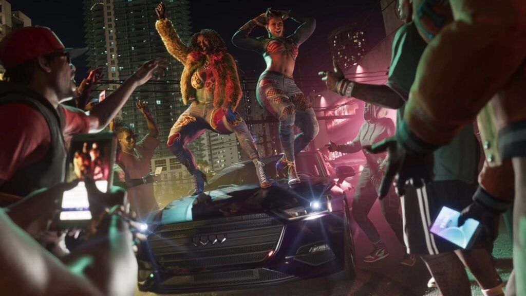 Women dancing on car hood at night street party