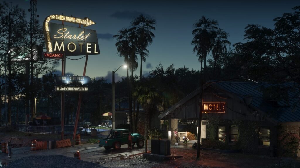 Neon Starlet Motel sign glowing at dusk roadside