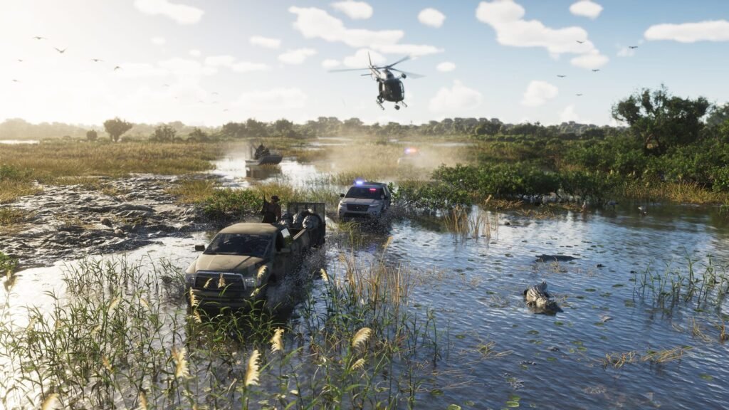 Helicopter and police cars chase truck through swamp